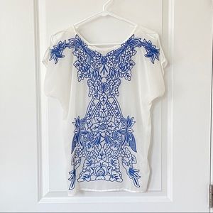 Alya Sheer white flowy top with blue floral embroidery. Size S. Beach cover up